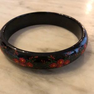 Lacquered wood bracelet from Ukraine.  Red flowers, green vines. Hand painted.
